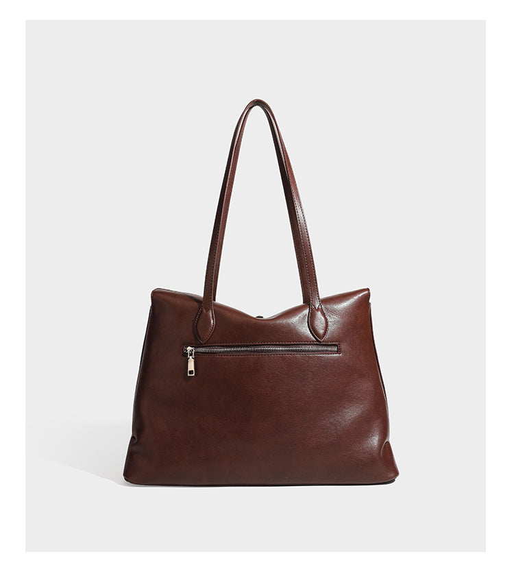 Large leather-look tote shoulder bag with slim double straps and silver-tone turn-lock closure, detail view 10