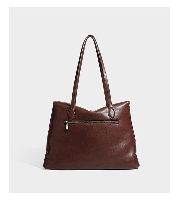 Large leather-look tote shoulder bag with slim double straps and silver-tone turn-lock closure, detail view 10