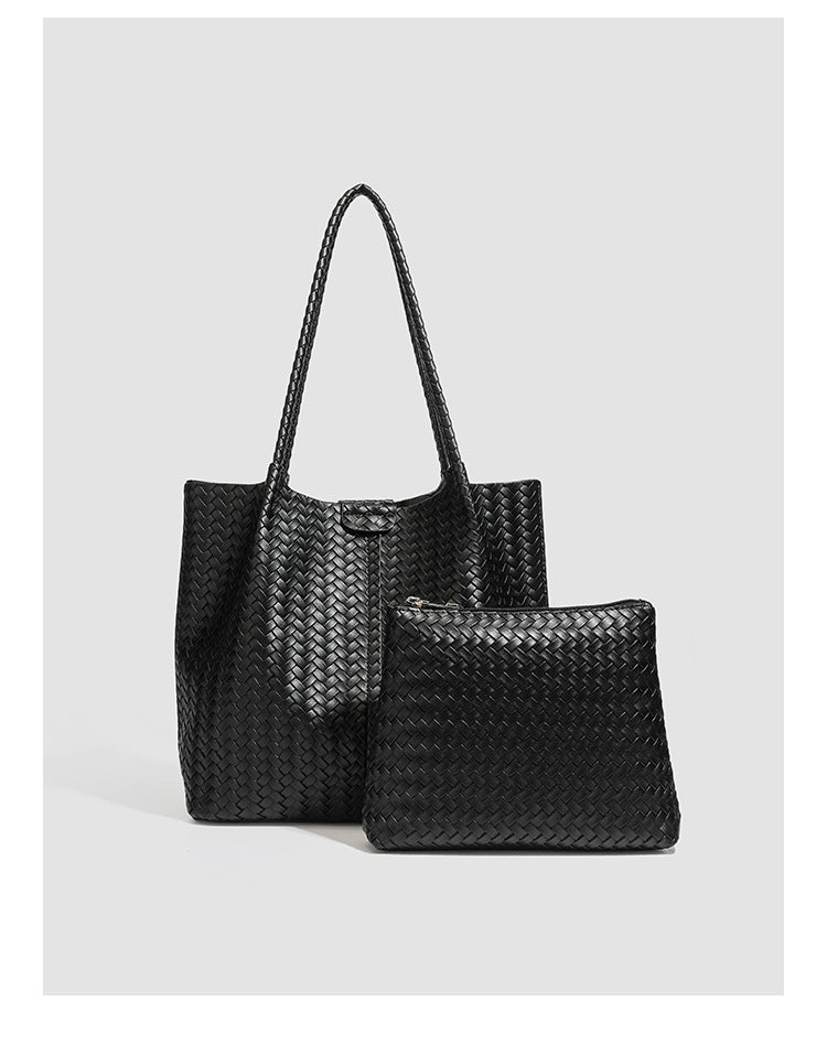 Large black basket-weave leather-look tote bag with long braided shoulder straps and matching woven zip pouch, detail view 11
