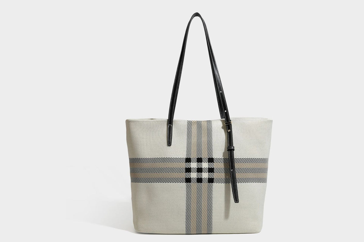 Large structured plaid check tote bag with smooth tan leather-look shoulder straps, attached front zip pouch, and gold-tone