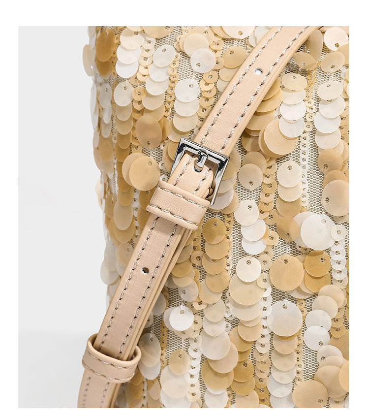 Champagne and ivory large-disc sequin shoulder bag with baroque faux-pearl beaded chain strap and silver-tone zip closure
