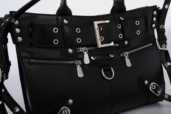 Black structured rectangular satchel bag with silver-tone rivets, large front buckle strap, zip pockets, dual top handles