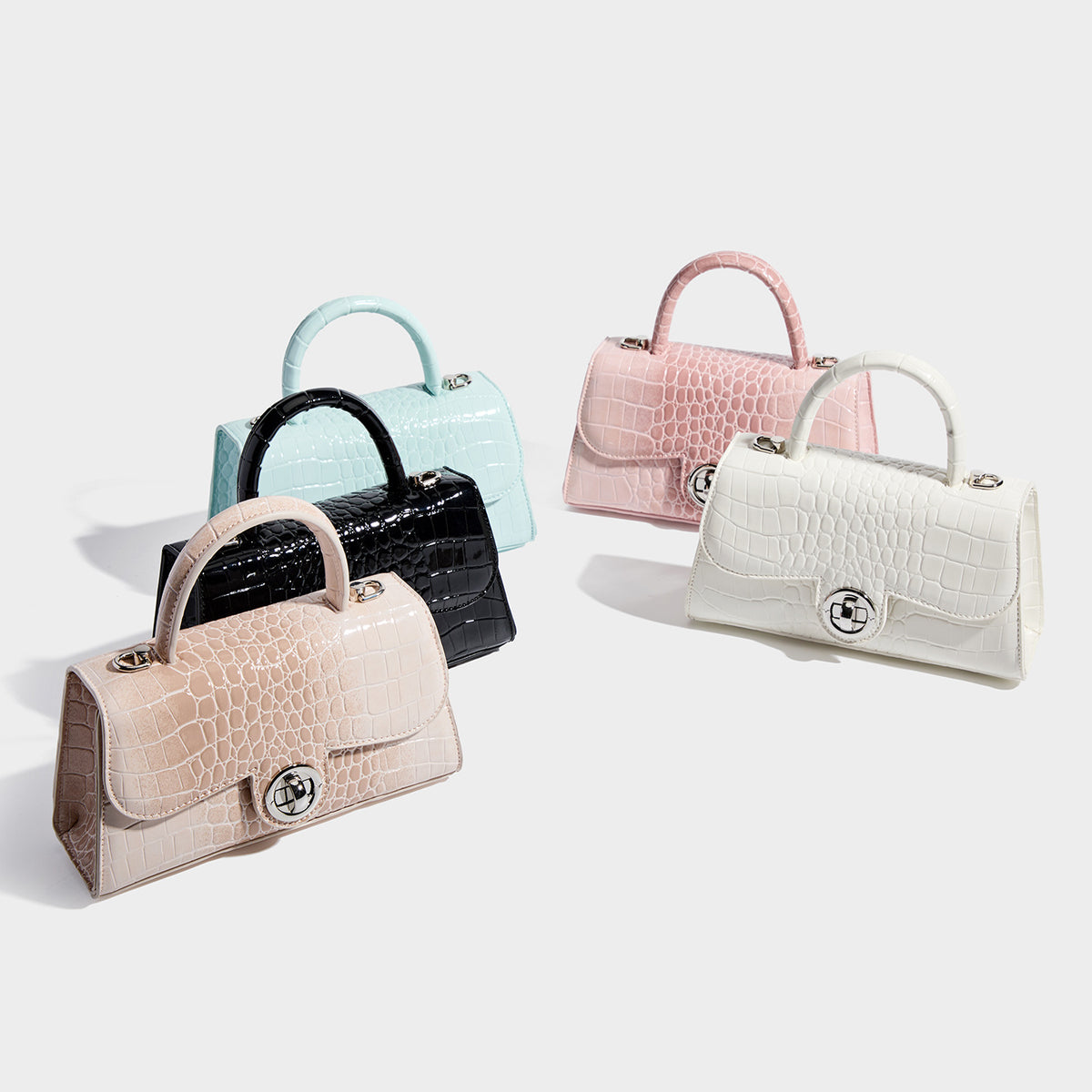 Mini croc-embossed glossy structured handbag with silver-tone turn-lock clasp and short top handle, detail view 2