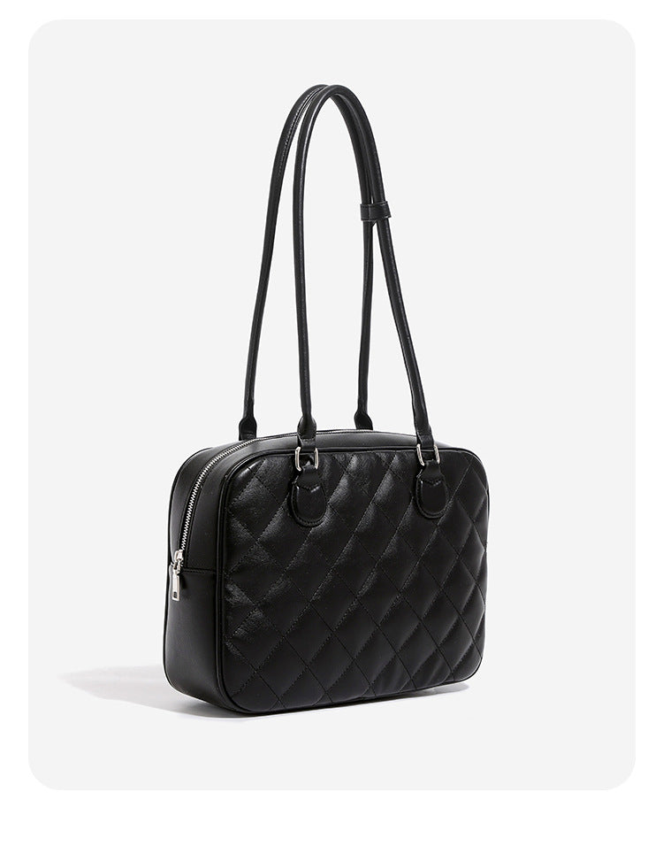 Structured diamond-quilted bowling shoulder bag with silver-tone hardware and top zip closure, detail view 9