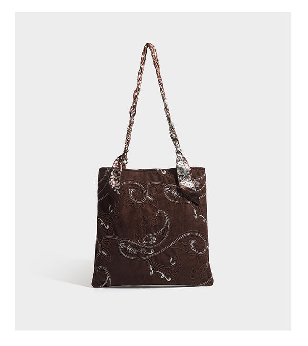 Brown suede-finish tote bag with paisley embroidery and braided fabric-ribbon shoulder strap, detail view 17
