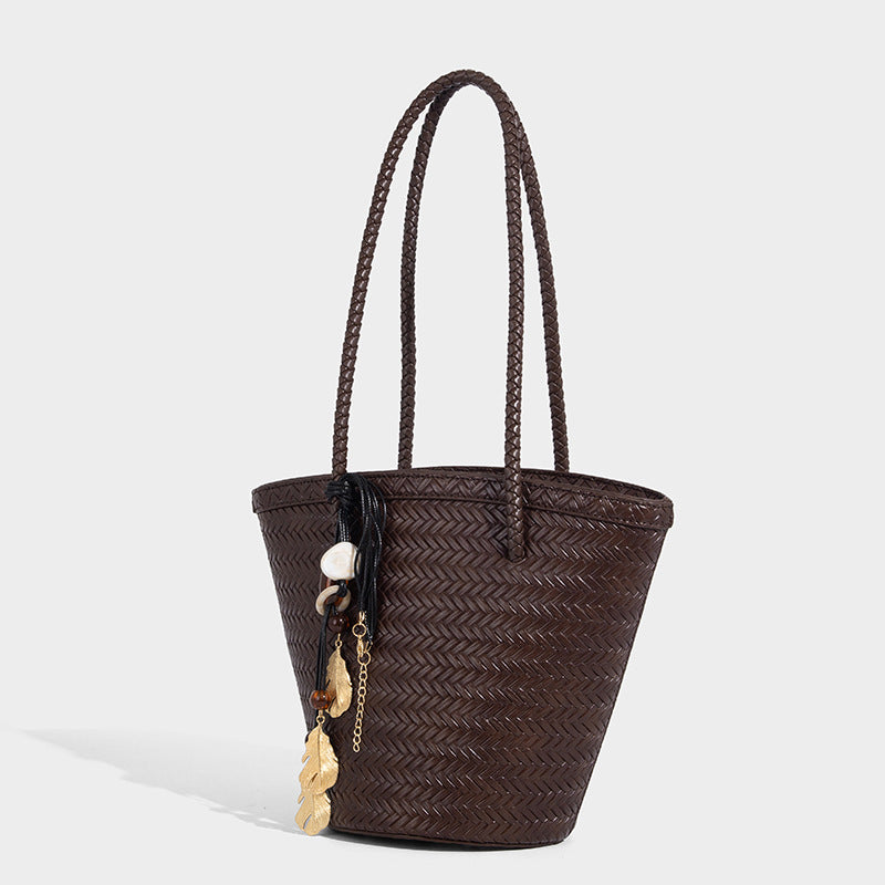 Chevron-woven bucket tote bag with braided shoulder straps and matching drawstring pouch, detail view 6