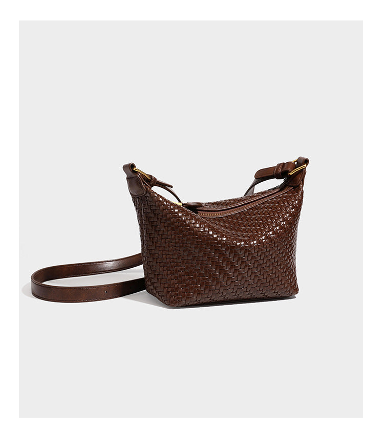 Small glossy basket-weave hobo shoulder bag in brown with knotted top handle, flap accent pocket, and gold-tone hardware