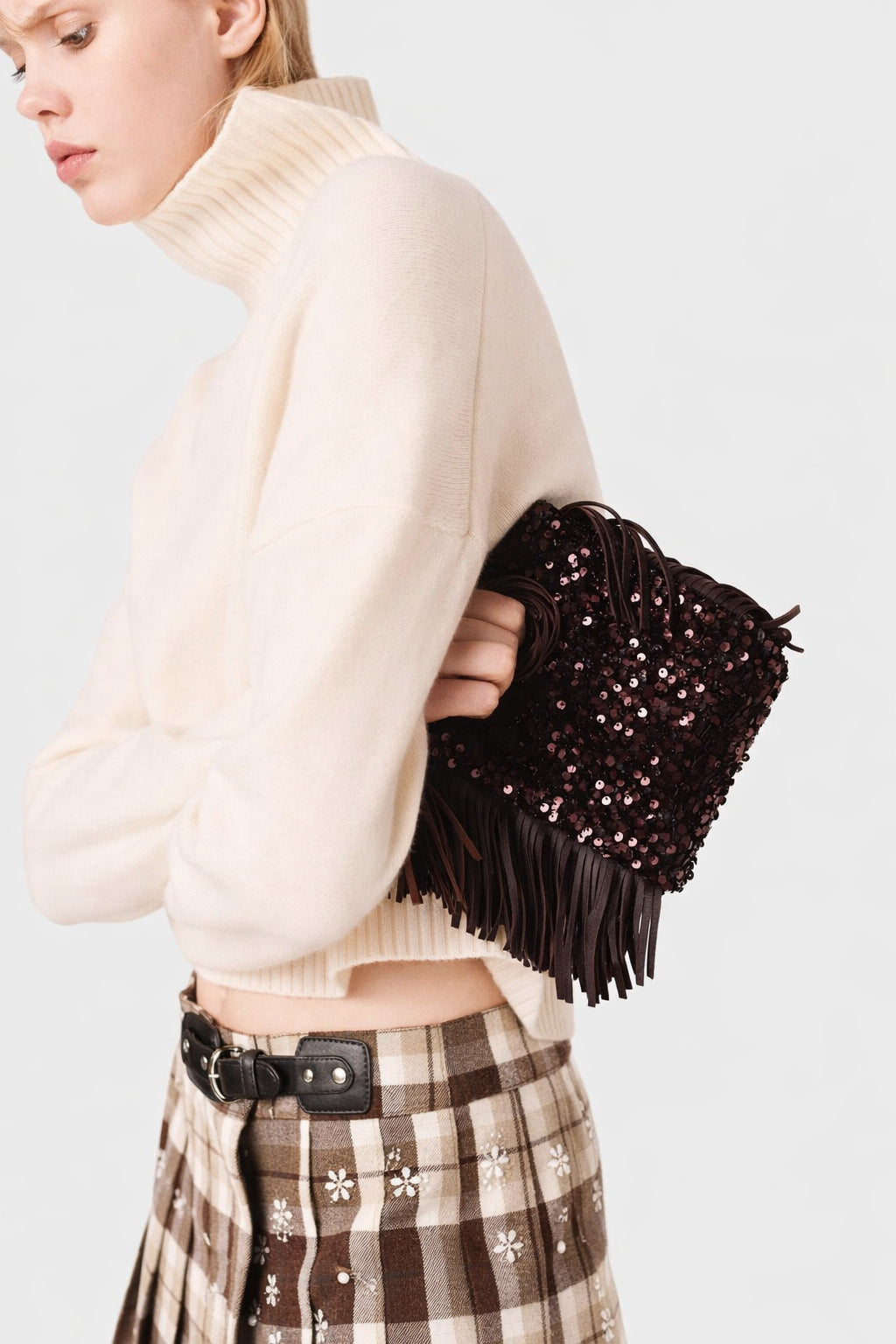 Small structured dark brown sequin handbag with leather-look fringe side trim and top cutout handle, detail view 9