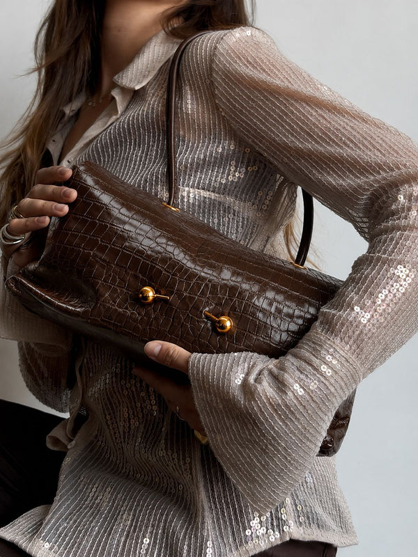 Wide embossed-texture shoulder tote bag with single loop handle and gold-tone toggle hardware, detail view 23