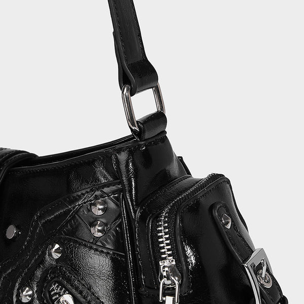 Compact glossy leather-look crossbody bag with silver studs, buckle hardware, and multiple zip pockets, detail view 21