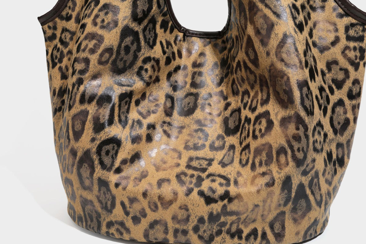 Large slouchy leopard-print shoulder tote bag with glossy tan-and-brown finish, dark brown leather-look trim, single