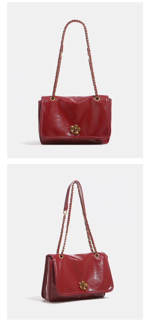 Structured glossy flap shoulder bag with antique gold floral turn-lock clasp and chain-and-leather strap, detail view 12