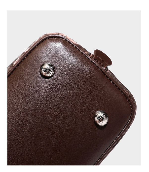 Strukturierte Henkeltasche mit tonal abgestimmtem Leopardenprint, Besatz in Lederoptik, gerollten Henkeln, vorderem Drehverschluss und