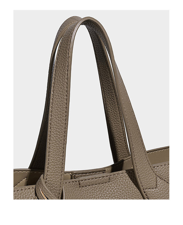 Compact pebbled bucket tote bag with elephant charm, twin top handles, and detachable crossbody strap, detail view 13