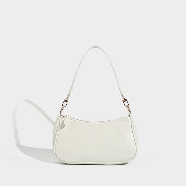 Kompakte Baguette-Schultertasche mit bogenförmiger Silhouette, strukturierter Oberfläche in Lederoptik und goldfarbenen Metalldetails, Detailansicht 7