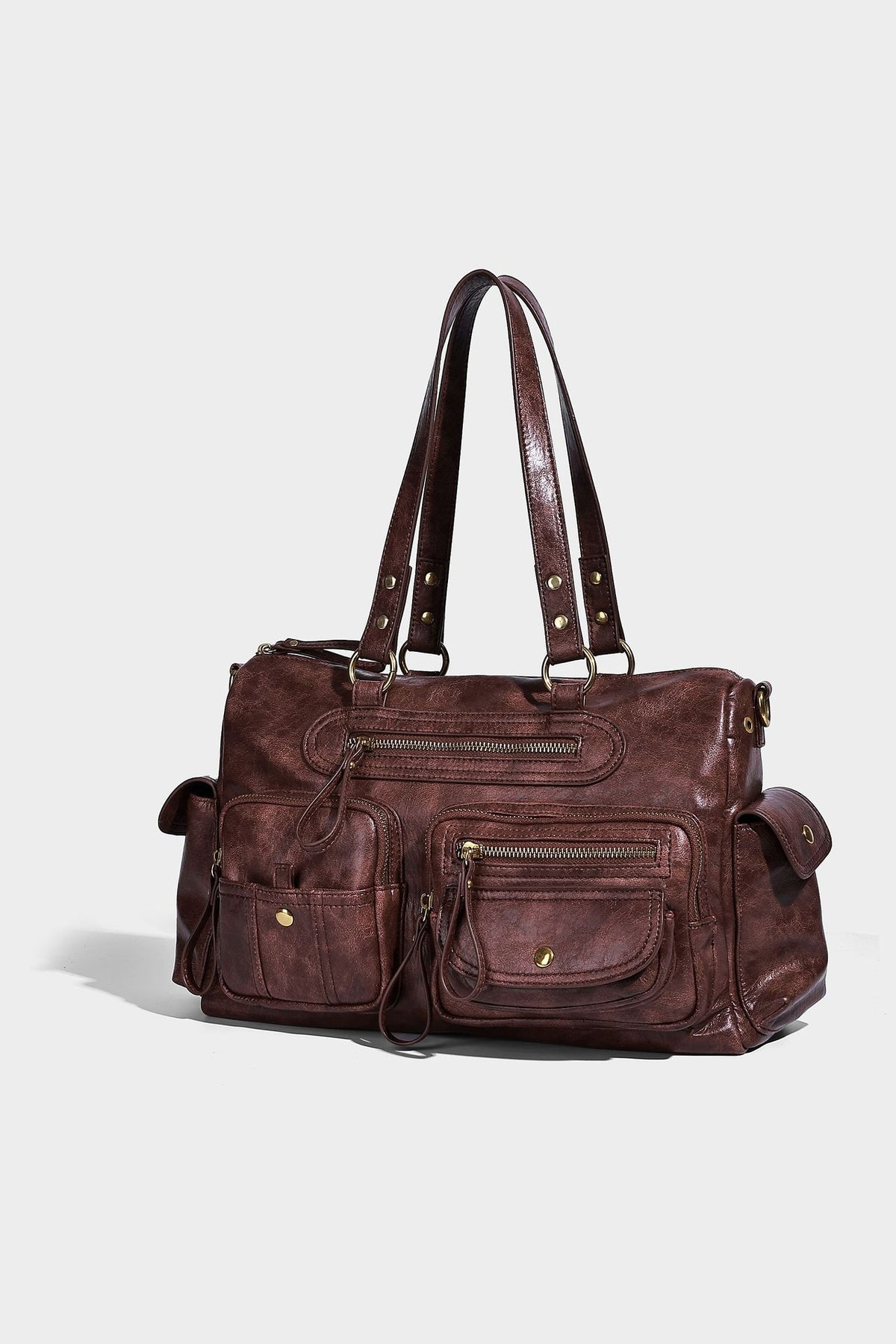 Distressed leather-look vintage satchel shoulder bag with multiple front zip pockets, dual top handles, and brass-tone