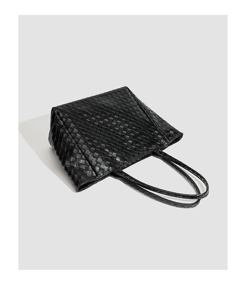 Large structured black woven diamond-pattern tote bag with braided double shoulder straps and glossy leather-look finish