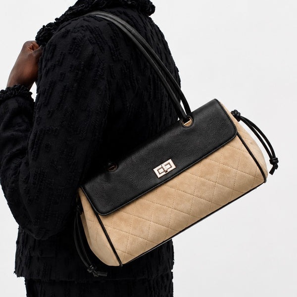 Compact two-tone quilted shoulder bag with black leather-look flap, silver turn-lock clasp, diamond-quilted body, side