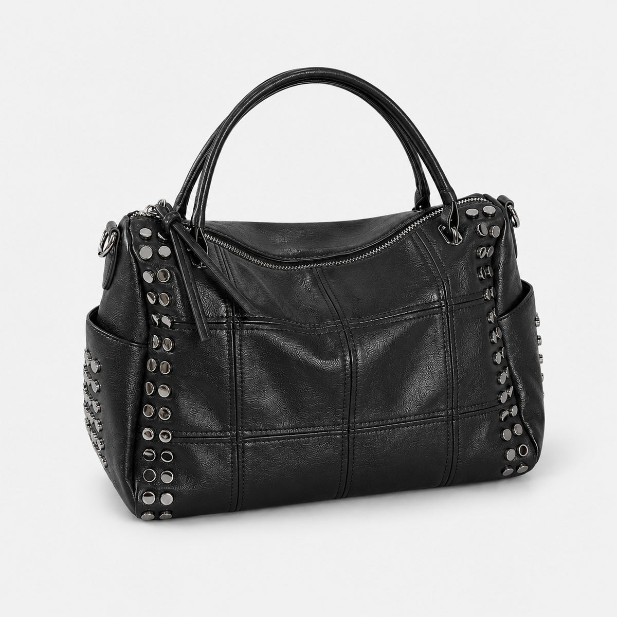 Black leather-look satchel bag with gunmetal rivet trim, grid-stitched paneling, dual rolled top handles, and curved zip