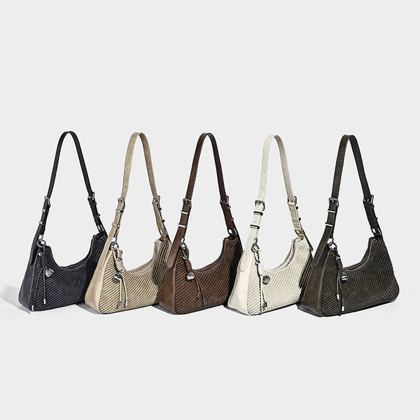 Woven crescent hobo shoulder bag with smooth side panels, zip-top closure, silver-tone charm hardware, and adjustable, detail