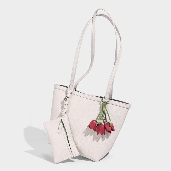 Structured pebbled leather-look tote bag in taupe with long shoulder strap, detachable zip pouch, and pink tulip flower