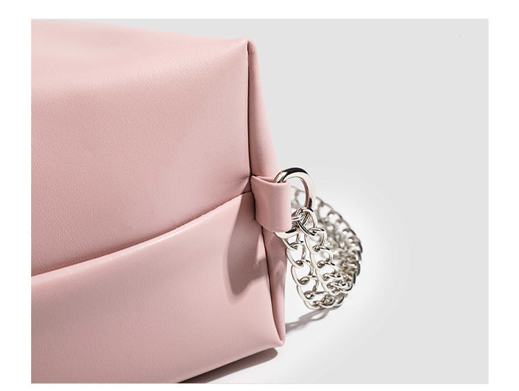 Glossy leather-look hobo shoulder bag with front bow lacing detail and silver-tone chain strap, detail view 10