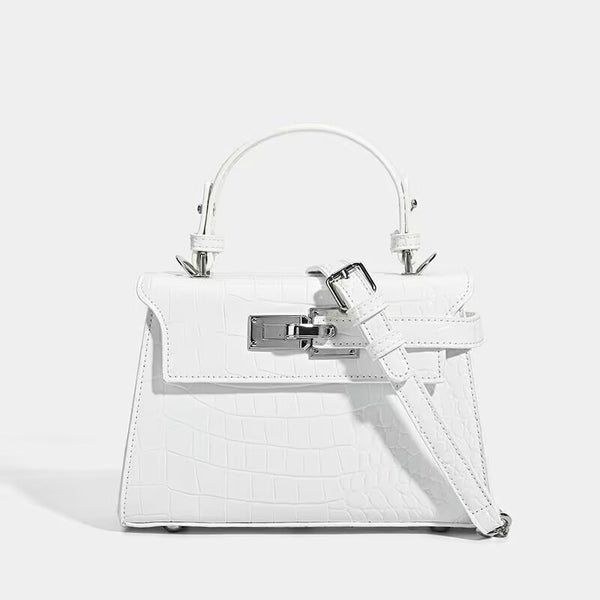 Croc-embossed mini top-handle satchel with silver turn-lock closure and adjustable crossbody strap, detail view 9
