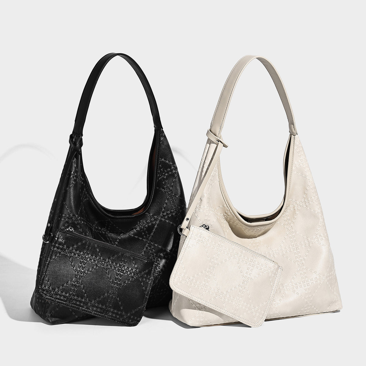 Slouchy hobo shoulder bag in ivory with embossed leather-look finish, single shoulder strap, and detachable zip pouch with