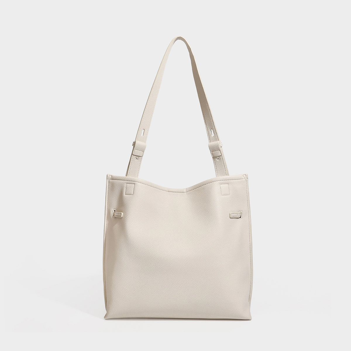 Large structured tote bag in pebbled leather-look finish with silver-tone twist-knot front detail and adjustable shoulder