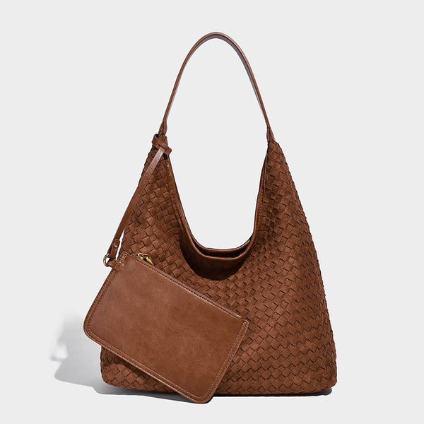 Large slouchy woven hobo tote bag with curved shoulder strap and triangular silhouette, detail view 3