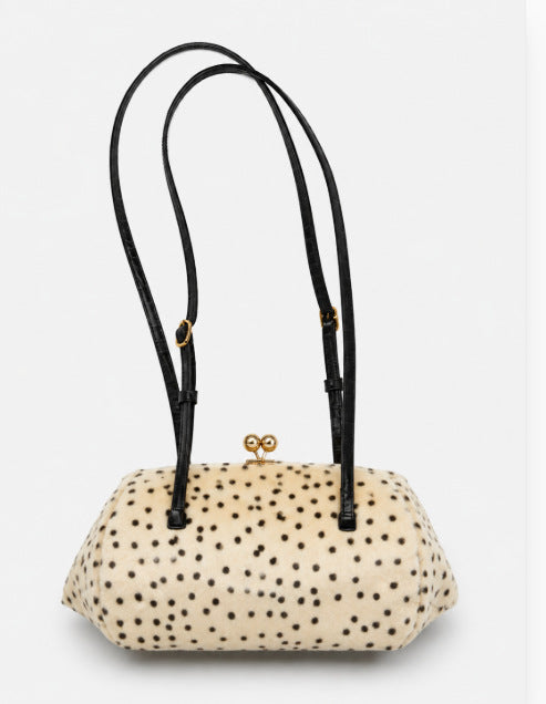 Spotted faux-fur barrel shoulder bag with gold kiss-lock clasp and black adjustable leather-look straps, detail view 8
