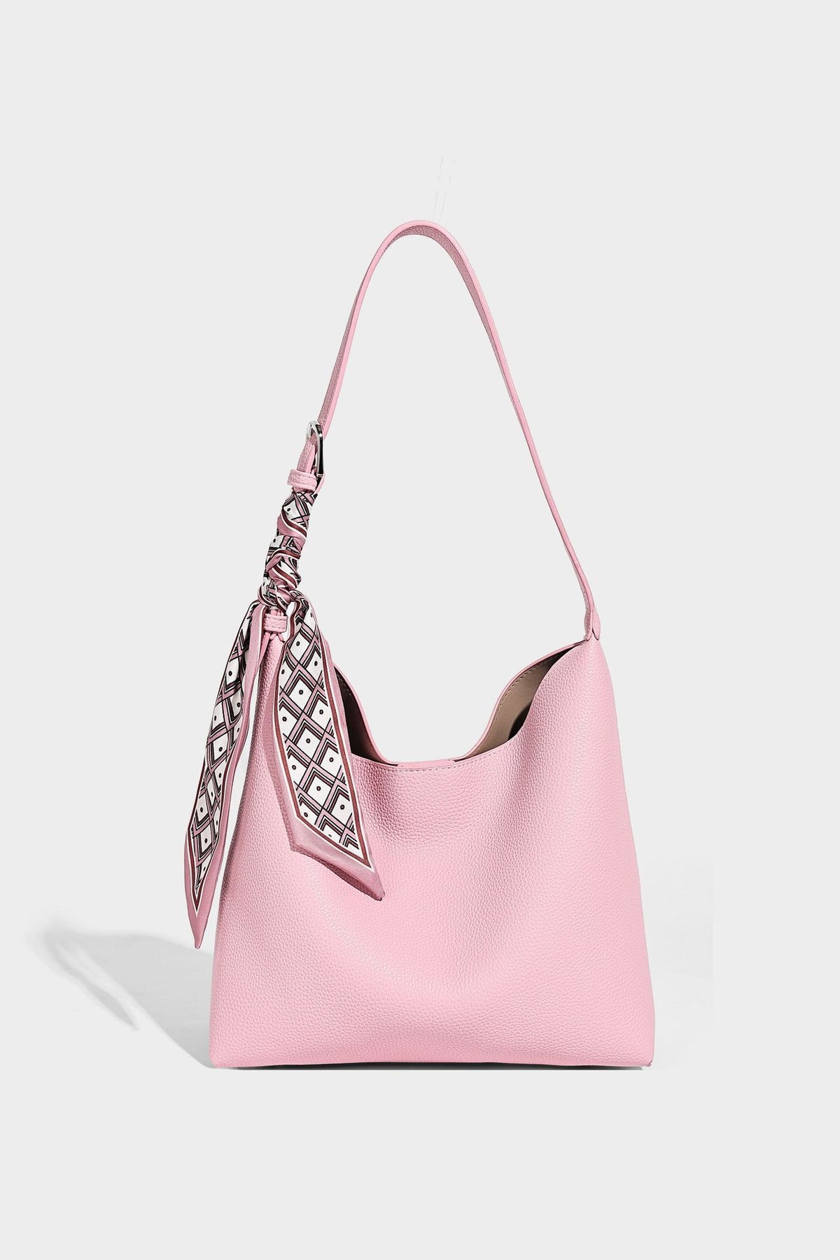 Soft slouchy hobo shoulder bag in pebbled matte finish with slim strap, silver-tone ring hardware, and knotted printed scarf