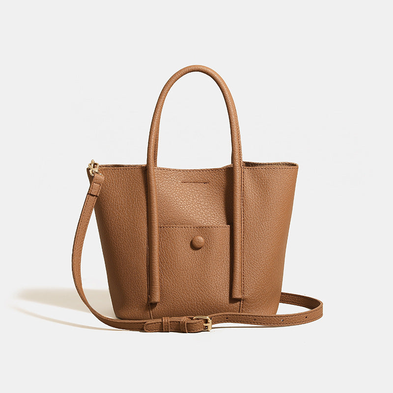 Structured pebbled matte tote bag with front snap pocket, dual top handles, and detachable zip pouch in almond beige, detail