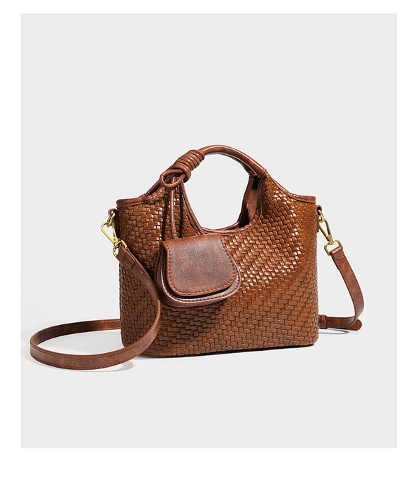 Woven leather-look tote bag in mocha brown with knotted top handle, front flap pocket, and detachable crossbody strap with