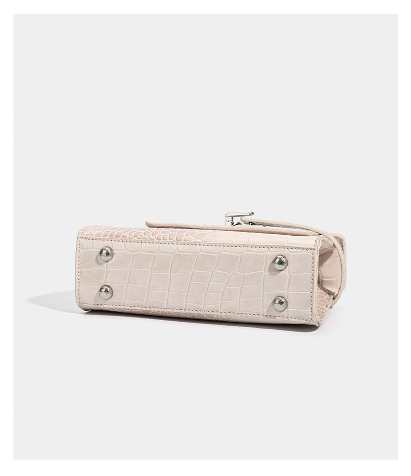 Croc-embossed mini top-handle satchel with silver turn-lock closure and adjustable crossbody strap, detail view 23