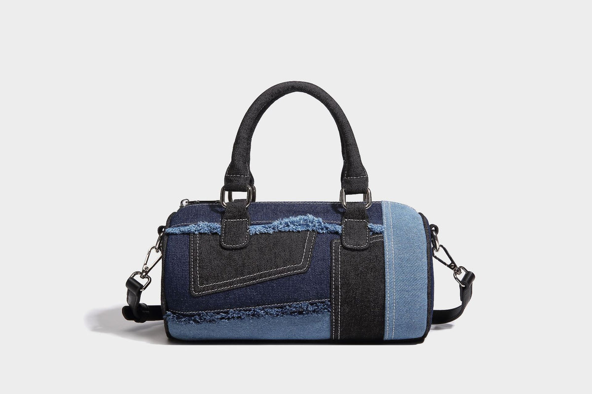 Mini barrel handbag in light and dark denim patchwork with frayed seam trim, dual top handles, top zip closure, and, detail