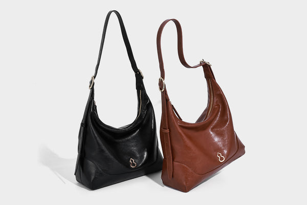 Glossy leather-look slouchy hobo shoulder bag with zip closure, gold-tone hardware, and adjustable strap, detail view 28