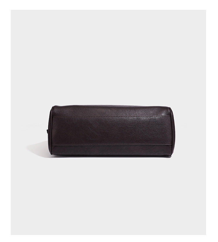 Structured rectangular flap shoulder bag in dark brown leather-look finish with long single strap and layered front panel