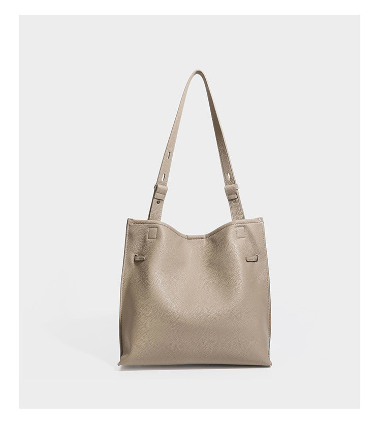 Pebbled leather-look tote bag with front toggle hardware and long shoulder strap, detail view 11