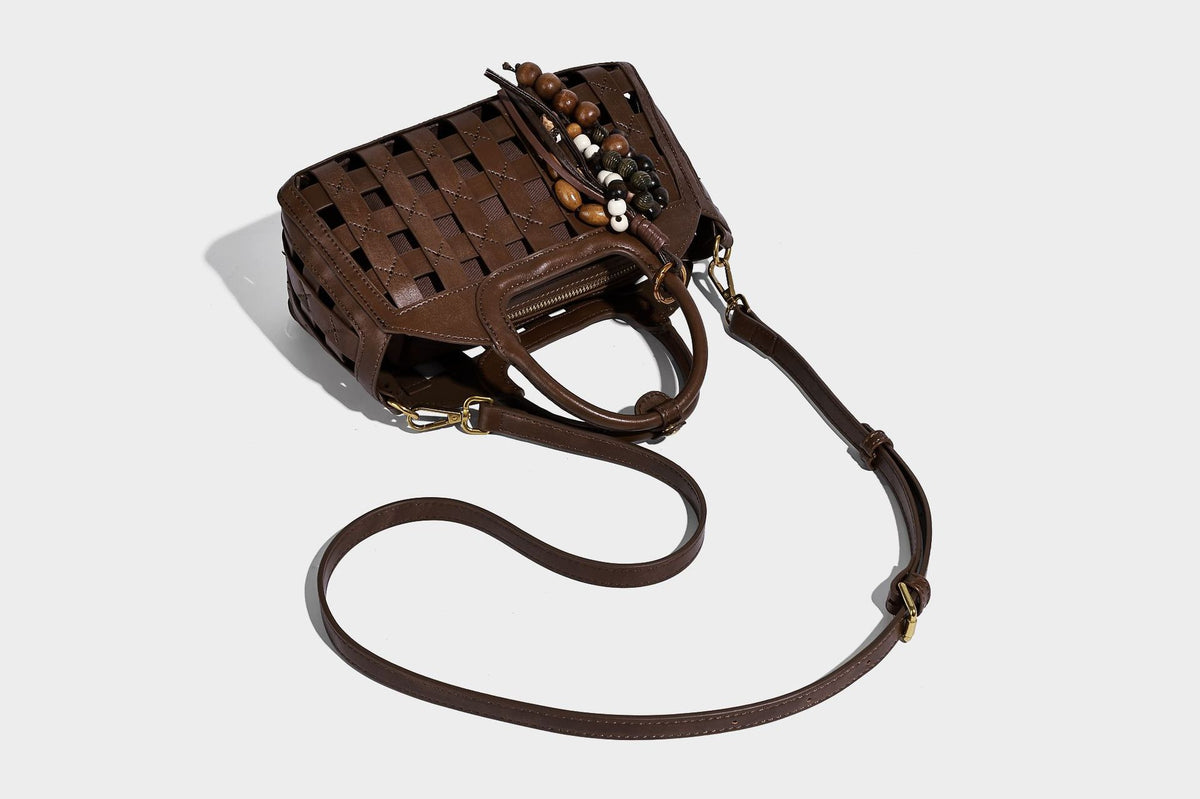 Small structured woven lattice top-handle satchel bag with bead-and-tassel charm and gold-tone hardware, detail view 26