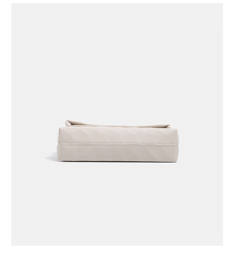 Geometric faceted flap shoulder bag with braided chain strap in black and ivory leather-look finish, detail view 12