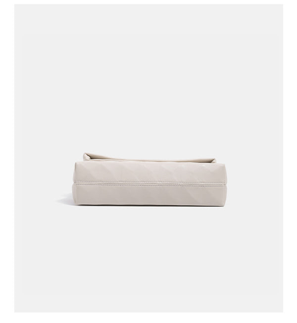 Geometric faceted flap shoulder bag with braided chain strap in black and ivory leather-look finish, detail view 12