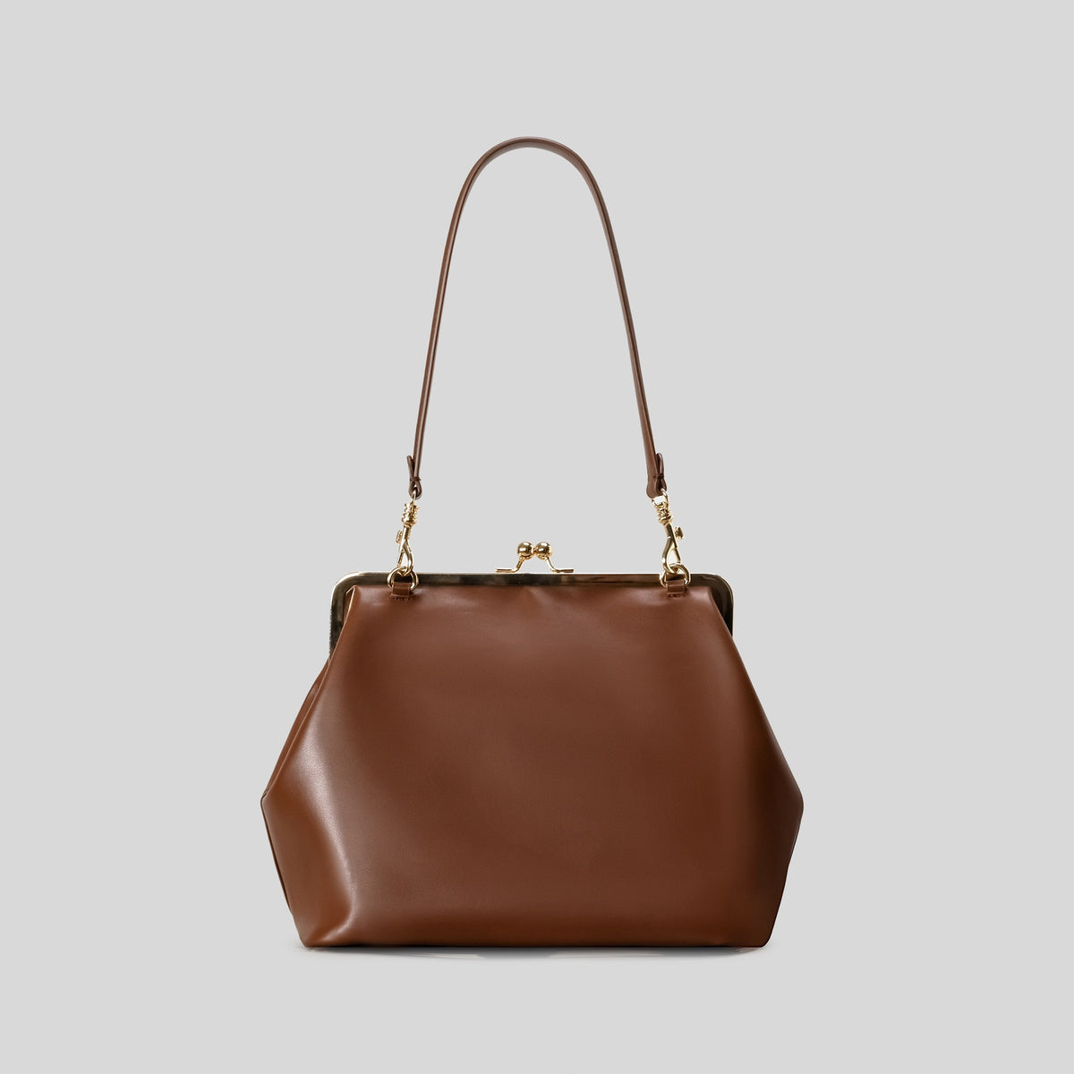 Trapezoid kiss-lock frame shoulder bag with gold-tone hardware and slim adjustable strap, detail view 10