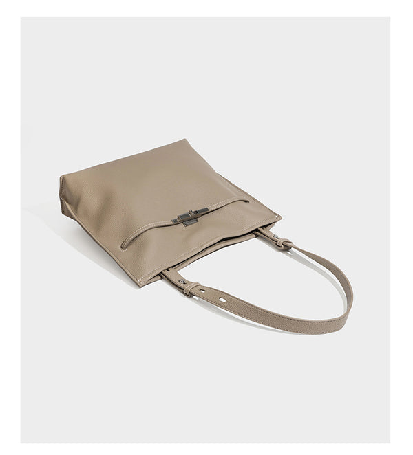 Large structured tote bag in pebbled leather-look finish with silver-tone twist-knot front detail and adjustable shoulder