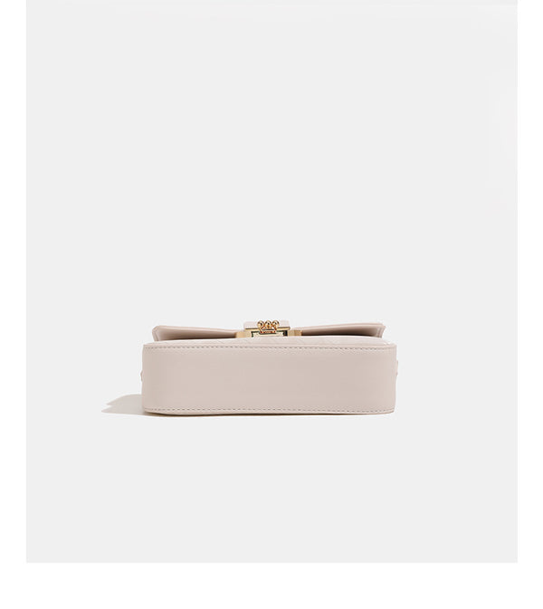 Compact rectangular quilted flap crossbody bag with gold-tone turn-lock closure and chain strap, detail view 16