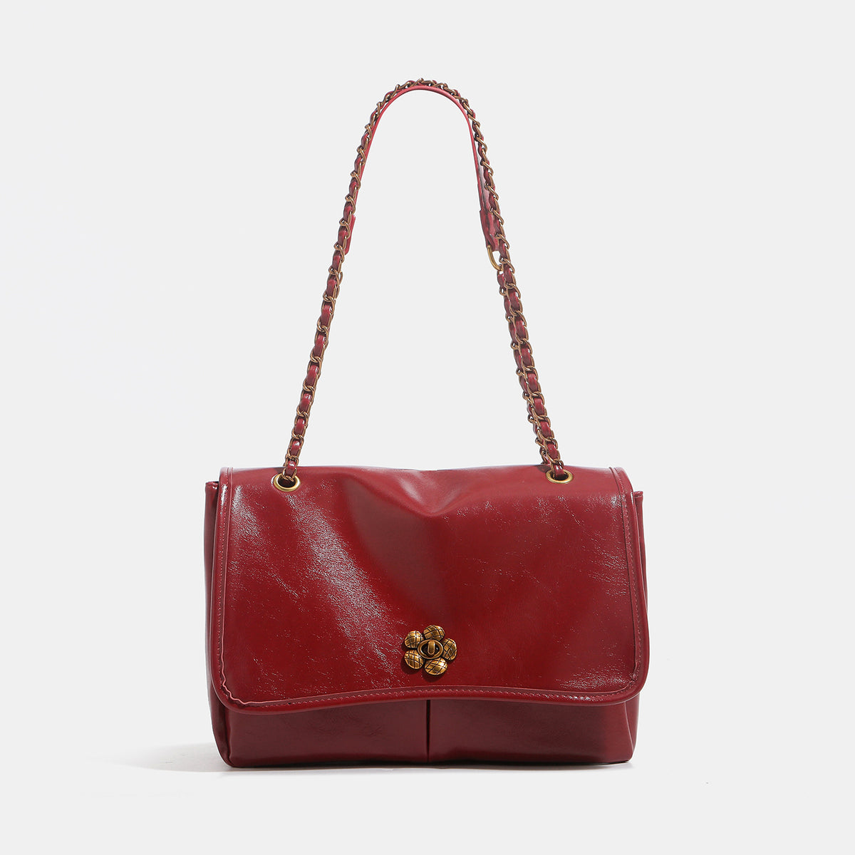 Structured glossy flap shoulder bag with antique gold floral turn-lock clasp and chain-and-leather strap, detail view 8