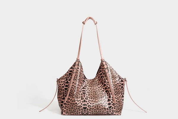 Large leopard print shoulder tote bag with glossy finish, long double straps, front zip pocket, silver-tone hardware, and