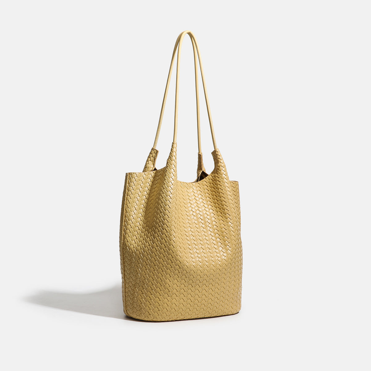 Large woven textured tote bag with long shoulder straps and structured rectangular base, detail view 3