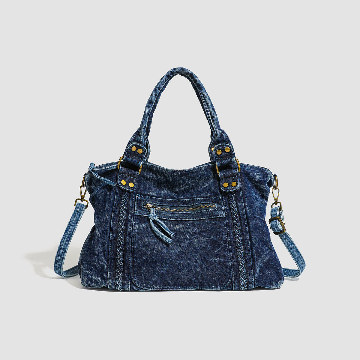 Large washed blue denim-look shoulder bag with gold-tone rings and rivets, top zip closure, front zip pocket, and adjustable