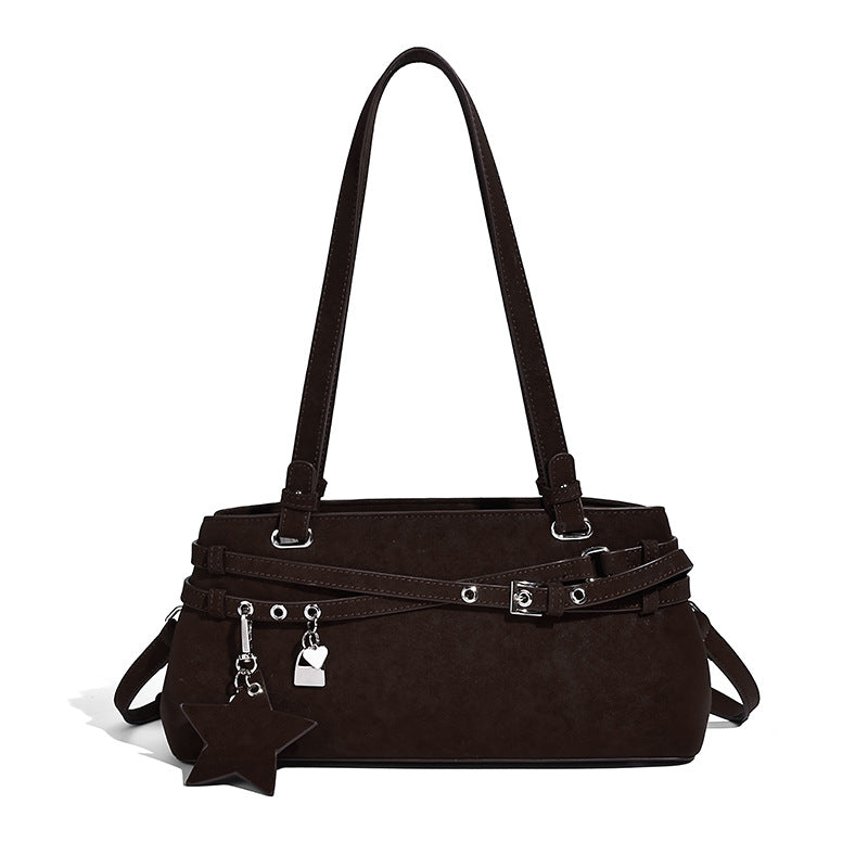 Structured trapezoid shoulder tote in dark brown matte suede-look finish with dual straps, wraparound belt bands